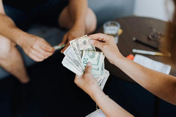 Two people counting money